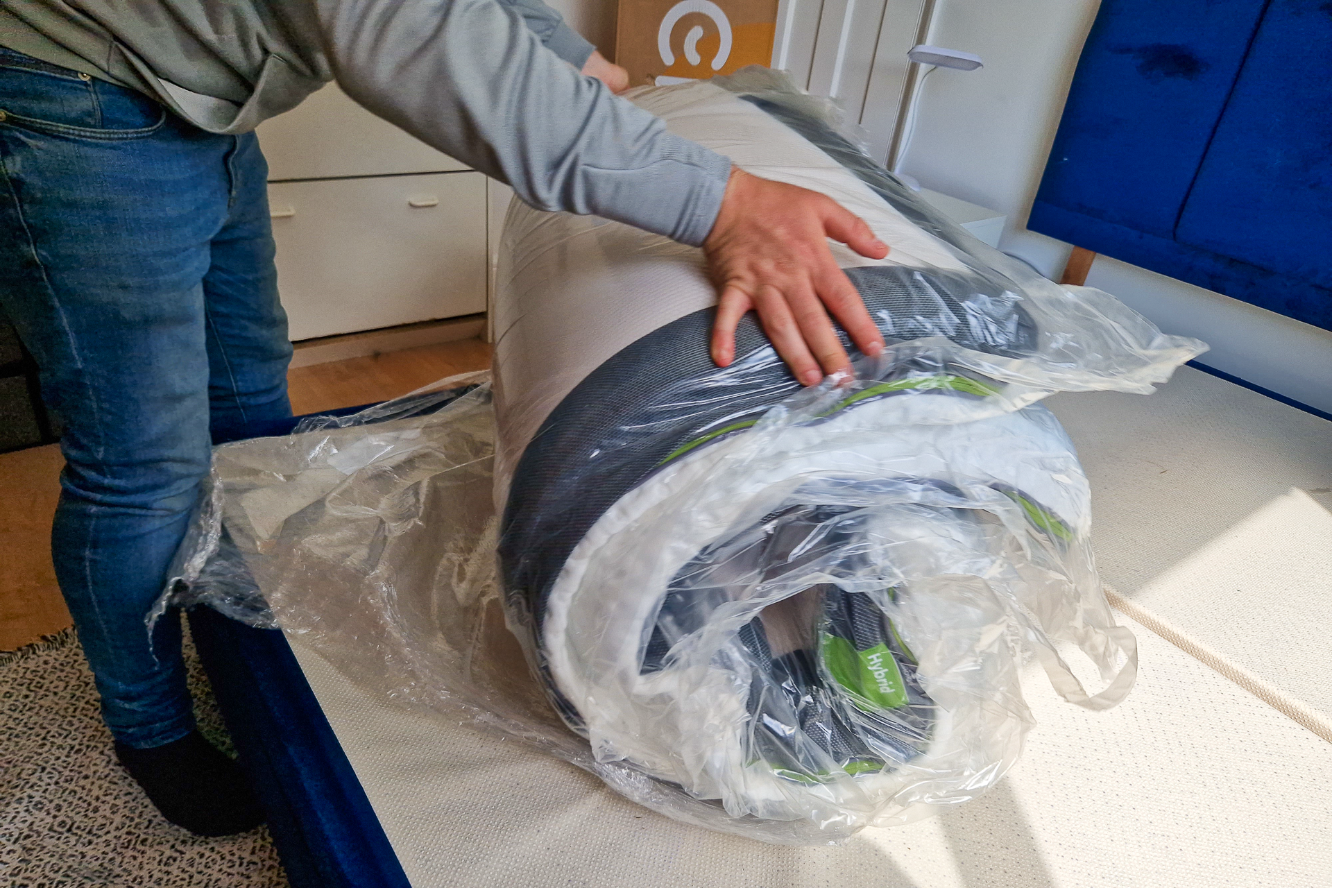 Cutting open the Emma mattress plastic cover